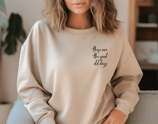 Sand colored crewneck sweatshirt with black text that reads "These Are The Good Old Days" on the left chest pocket area.  Mom life motivation, mom life struggles, womens clothing, womens sweaters, womens sweatshirts.