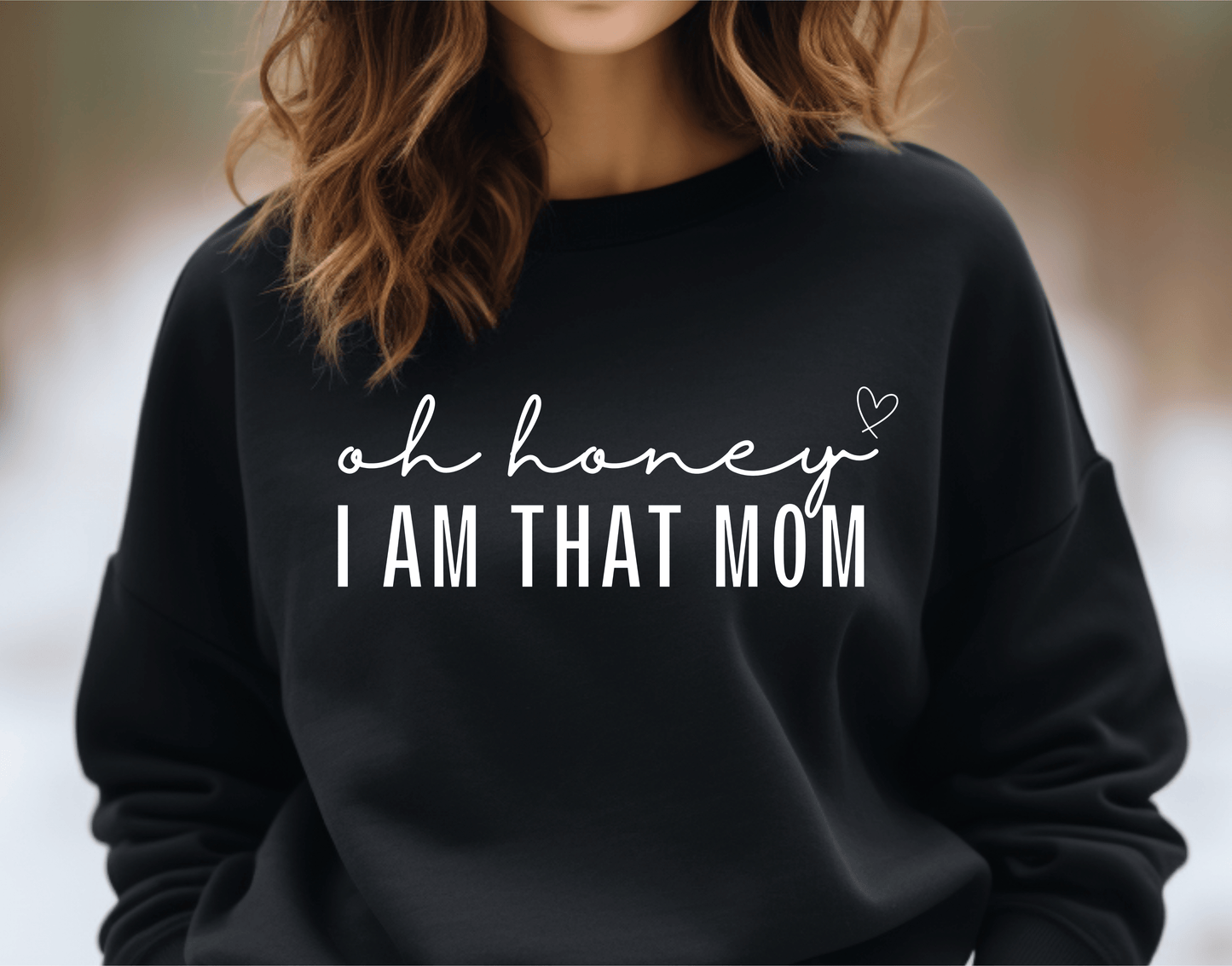 Women’s black crewneck sweatshirt with white text that read “oh honey, I am that mom.”